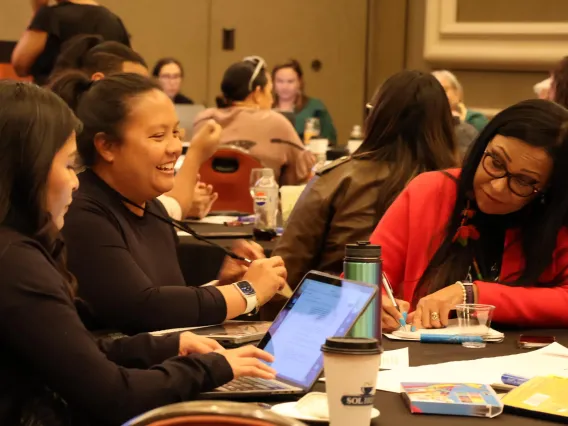 Attendees work as a group during an IDSov Summit session.
