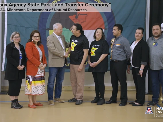 Governor Tim Walz and Chairman Kevin Jensvold of the Upper Sioux Community shake hands during the Upper Sioux State Park land transfer ceremony