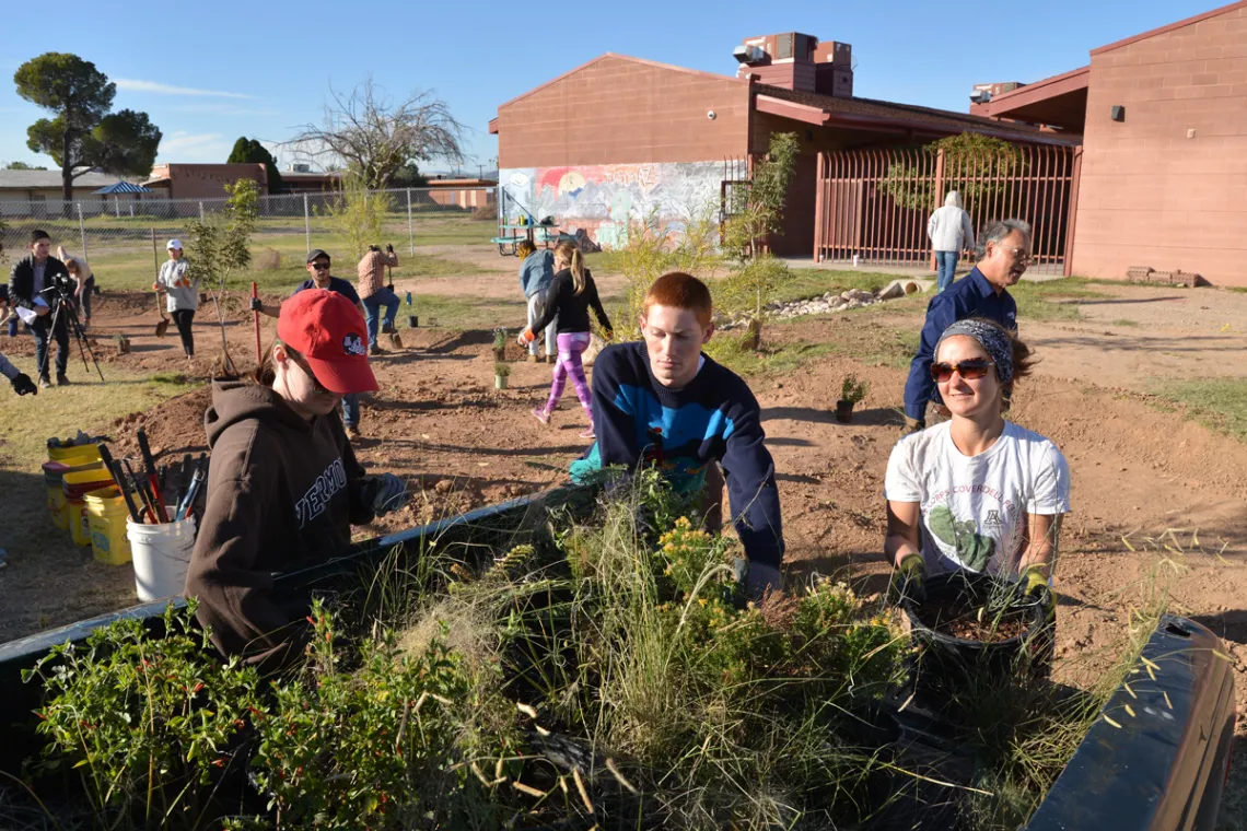 Construction of green infrastructure that will direct stormwater to native trees and grasses they are planting to improve the landscape at Star Academic High School.