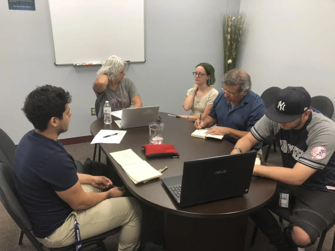 Design revisions meeting with STAR high school representatives. Participants include: Principal at STAR High School, Marsha Flores; Science teacher, Rene Corrales; Assistant principal Joel Palomores; Project coordinator, Adriana Zuniga-Teran; and MLA students Grace Stoner and Isaac Palomo.