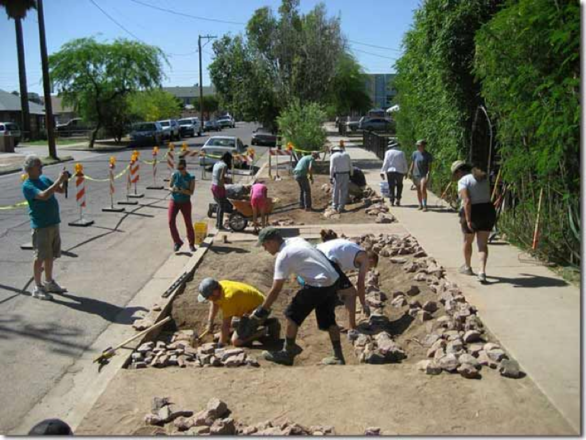 Figure 4. Residents of Tucson collaborating in a green infrastructure project (Photo: Watershed Management Group). 
