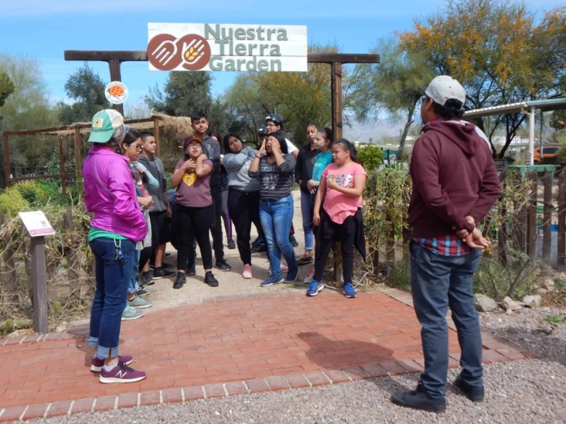 The group of students visited the Community Food Bank and learned about food production