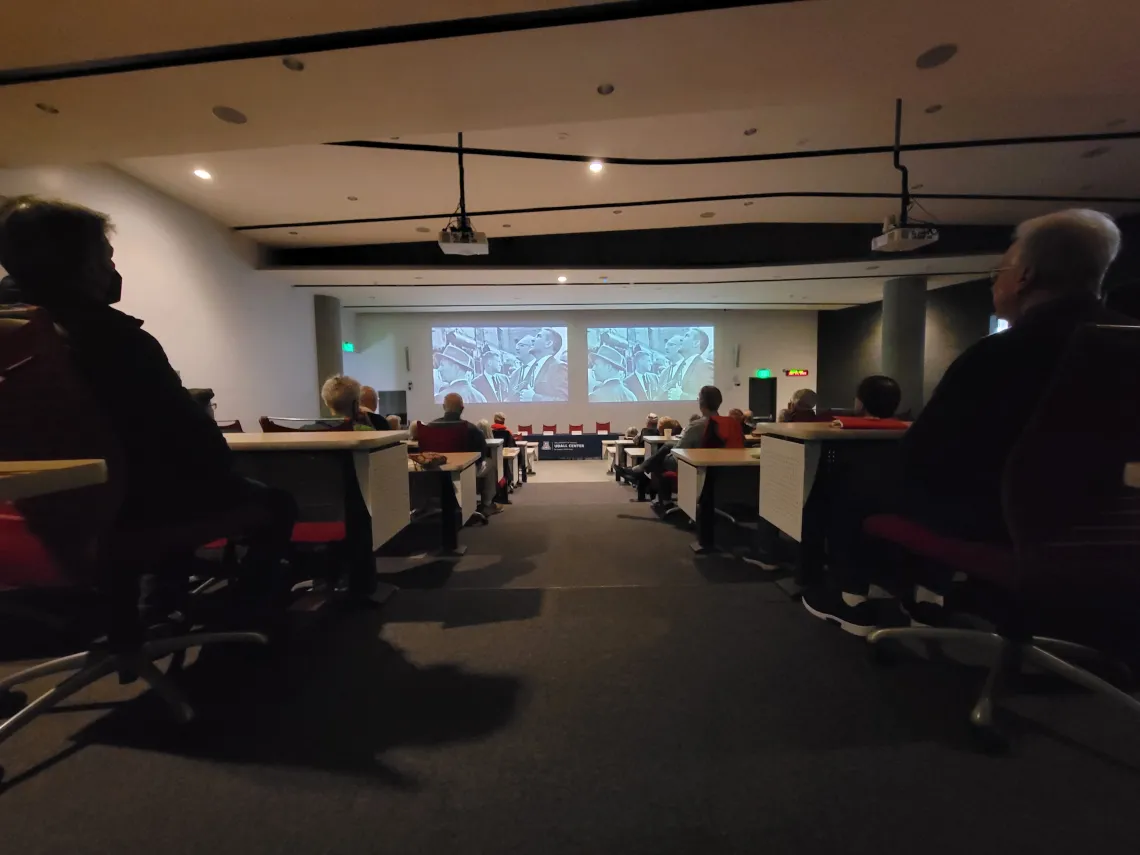 A crowd watches a dual projection of the new documentary on Stewart Udall in UA's ENR2 building.