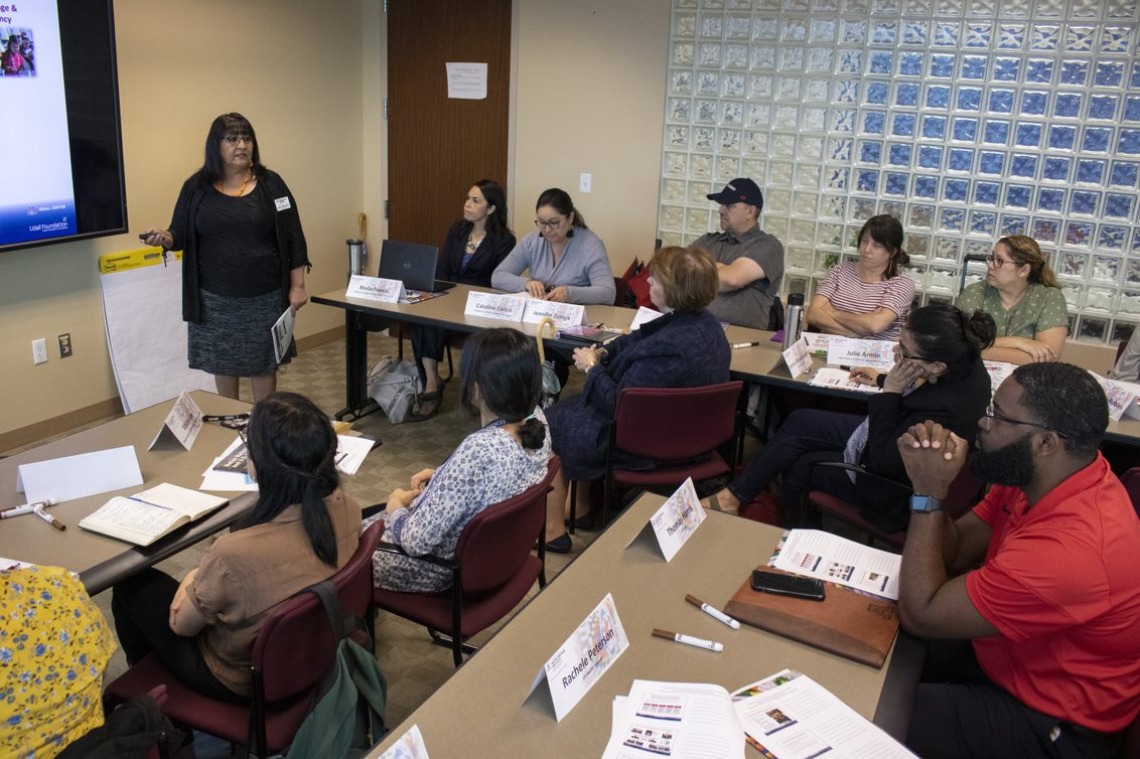 Native Know-How instructor Joan Timeche delivers a seminar to a crowded classroom in 2019.