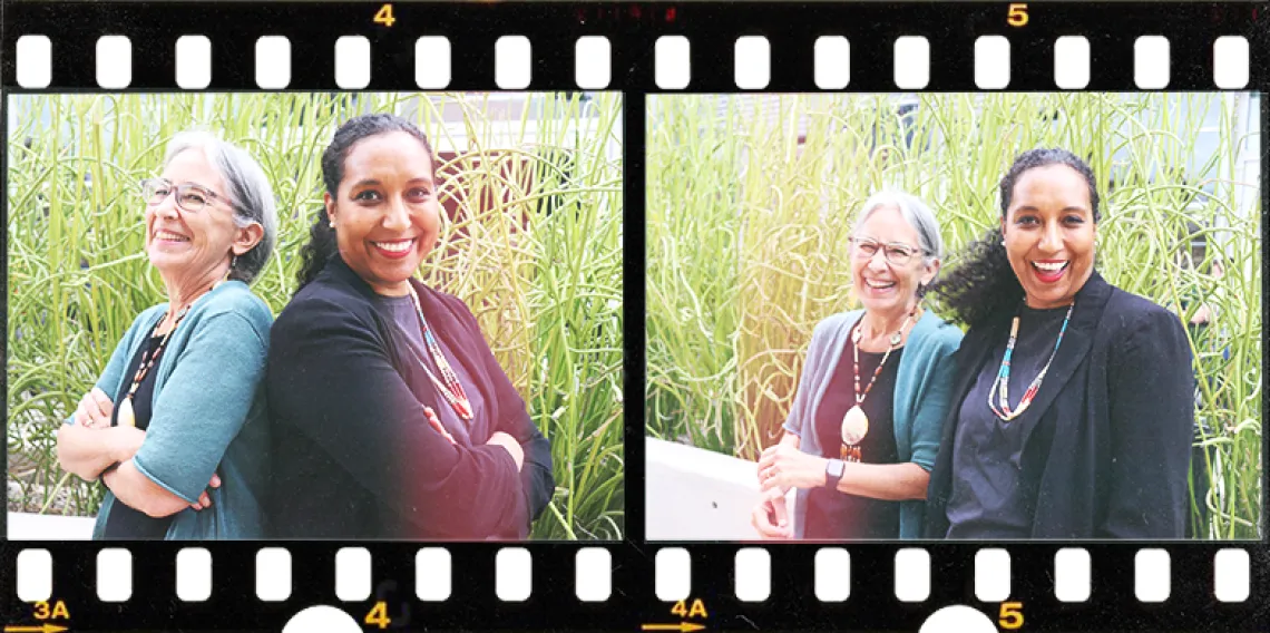 Two panels in a flim strip show Natsu Tailor Saito in a blue cardigan standing back-to-back with her daughter Akilah Kinnison in a black cardigan in front of a planter full of succulent plants. The panel to the right is in the same location but features both subjects facing the camera and laughing.