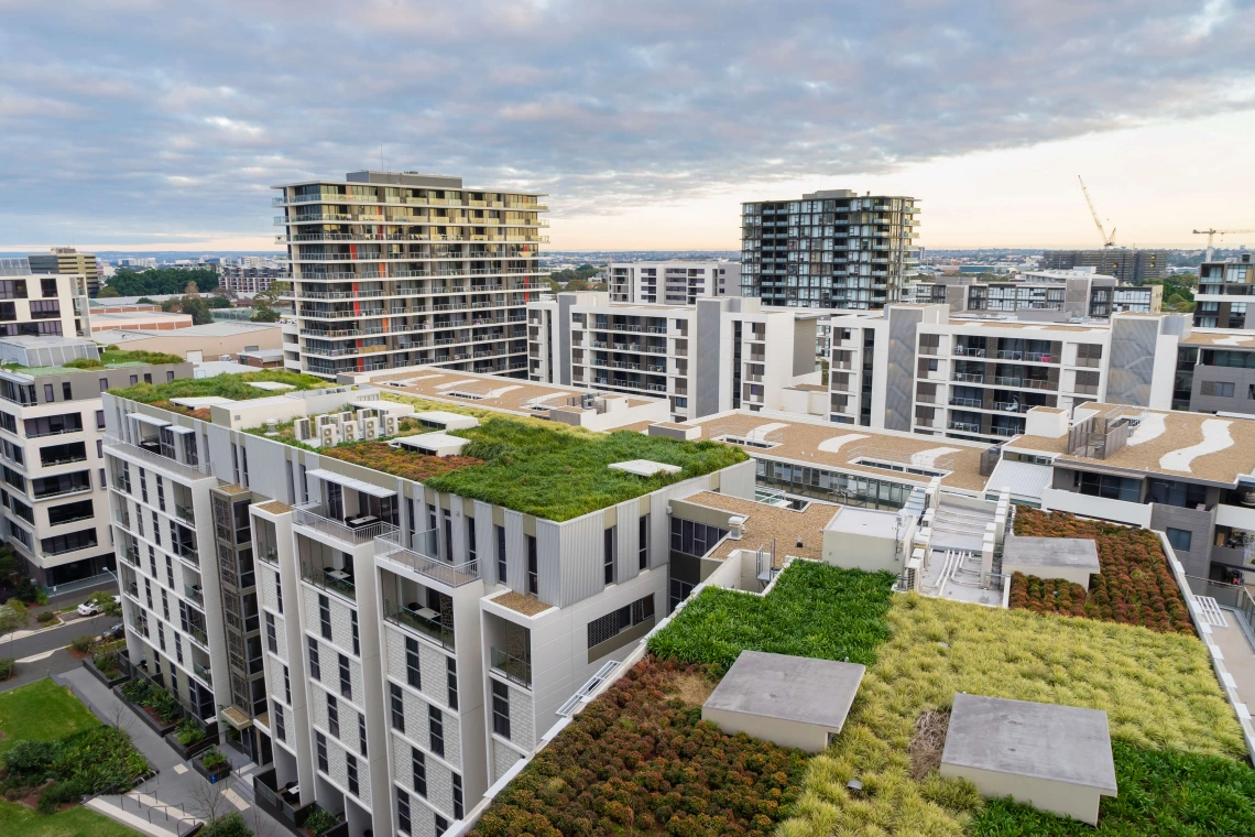 aerial view of an apartment building with a green roof