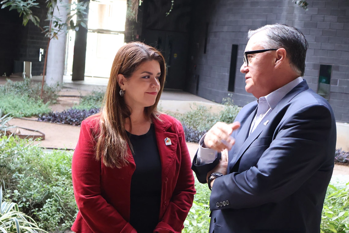 Mayor Regina Romero and U of A SVPR Tomas Diaz de la Rubio chat in the ENR2 courtyard 