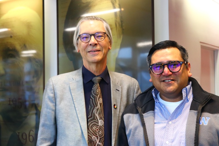UArizona Law Professor Robert William, Jr. and Indigenous Governance Program Manager Tory Fodder pose in the law school lobby on opening day of JIT 2023.