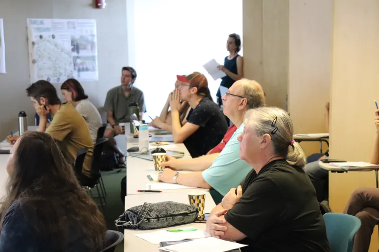 Teachers look on during presentations by researchers at the University of Arizona College of Architecture, Planning & Landscape Architecture.