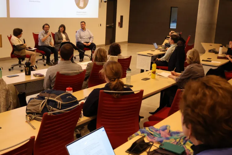 Dustin Garrick speaks into the microphone during the "Elephants in the Room" panel discussion..