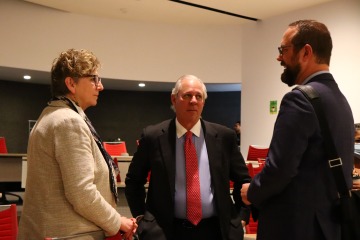 Nancy Pollock-Ellwand, UArizona President Robert Robbins, and Professor Ladd Keith in discussion after the conclusion of the Environmental Justice and Health Equity meeting.