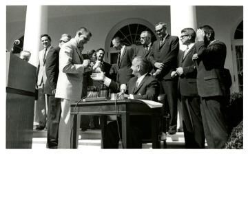 Outdoor signing of The Wilderness Bill with President Lyndon B. Johnson, 1964.