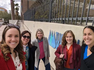 Andrea poses with Udall Center researchers outside the Tucson Water building.