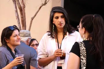 Attendees mingle and chat during the Summit's opening night mixer.