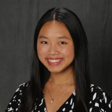 Portrait of Jordyn Leith-Bailess in front of a gray background.