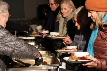 Chef Janos WIlder serves attendees during the second annual agrivoltaics dinner