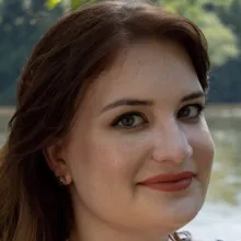 Portrait of Meredith Jolin with a natural body of water in the background